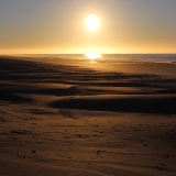 The sun setting on the dunes